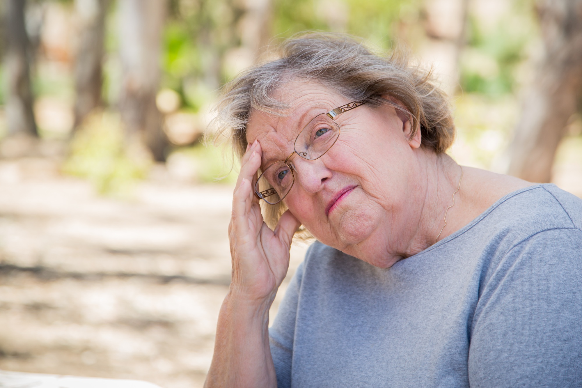 Upset Senior Woman Sitting Alone